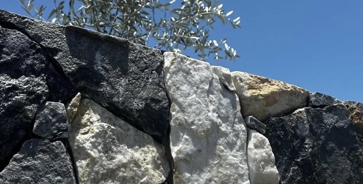 Basalt and limestone stone wall cladding, hand-fitted joints