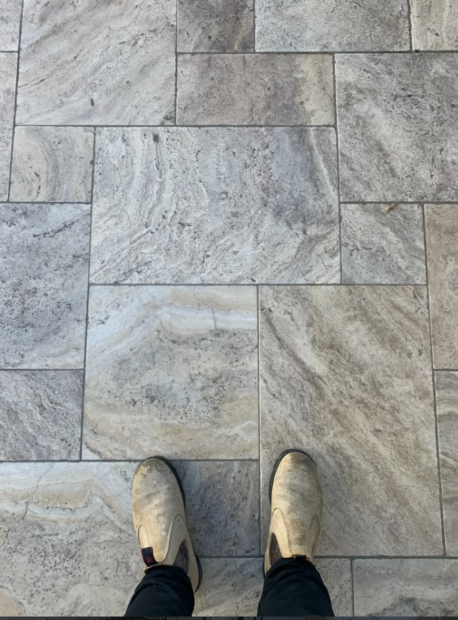 French pattern travertine paving laid across an outdoor courtyard